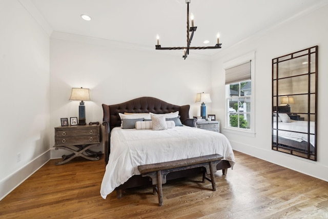 1224 Adams St, Franklin, TN 37064 - bedroom featuring crown molding, a chandelier, baseboards, recessed lighting, and wood finished floors