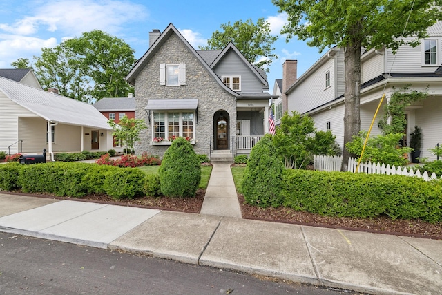 1224 Adams St, Franklin, TN 37064 - view of front of home with stone siding, fence, and a chimney