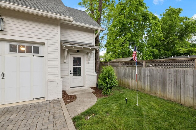1224 Adams St, Franklin, TN 37064 - view of exterior entry featuring brick siding and roof with shingles