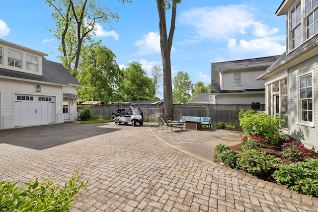 1224 Adams St, Franklin, TN 37064 - view of patio / terrace with fence, a garage, and an outdoor hangout area
