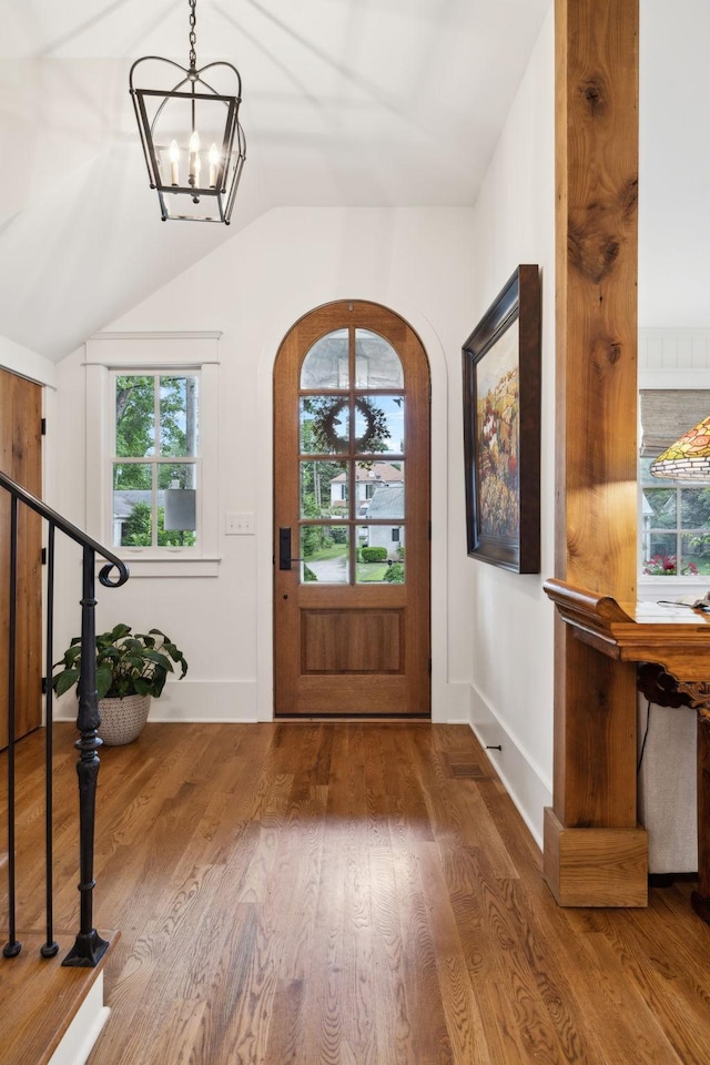 1224 Adams St, Franklin, TN 37064 - entryway featuring vaulted ceiling, a chandelier, healthy amount of natural light, baseboards, and wood finished floors