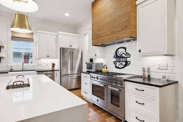 1224 Adams St, Franklin, TN 37064 - kitchen featuring high end appliances, a sink, premium range hood, tasteful backsplash, and dark countertops