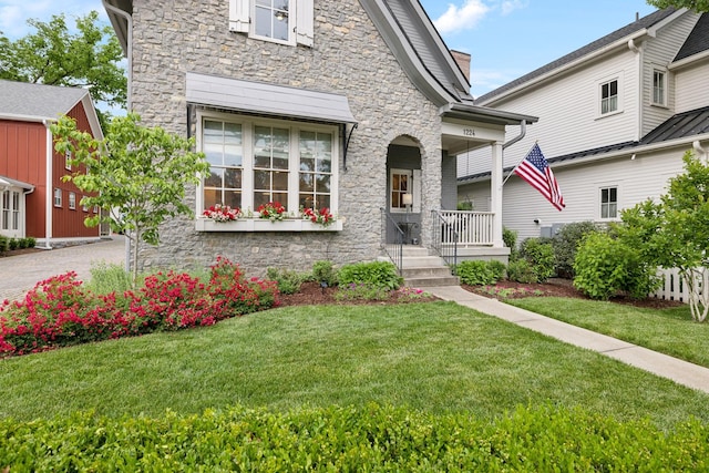 1224 Adams St, Franklin, TN 37064 - view of front facade with stone siding, covered porch, and a front yard