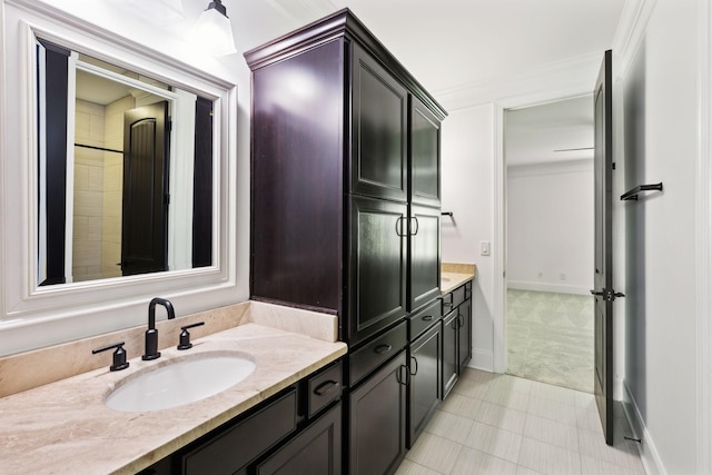 full bathroom featuring vanity and baseboards