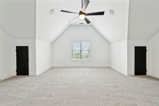 additional living space with carpet flooring, vaulted ceiling, a ceiling fan, and baseboards