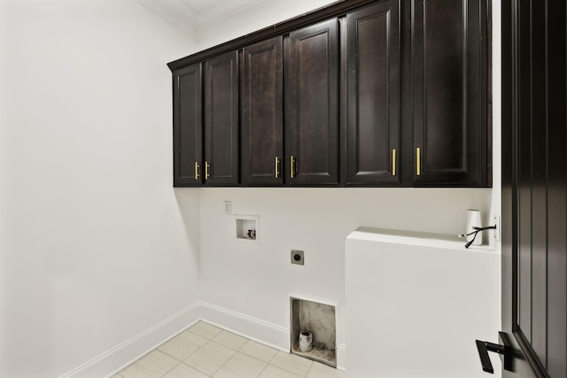 laundry room featuring electric dryer hookup, cabinet space, washer hookup, and baseboards