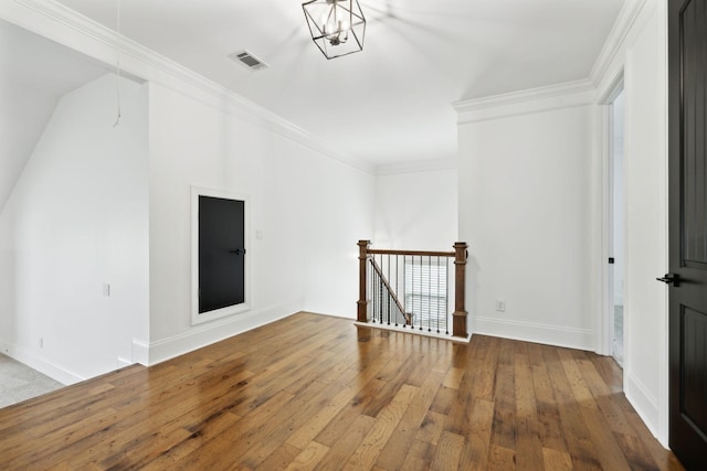 bonus room featuring wood-type flooring, a chandelier, and baseboards
