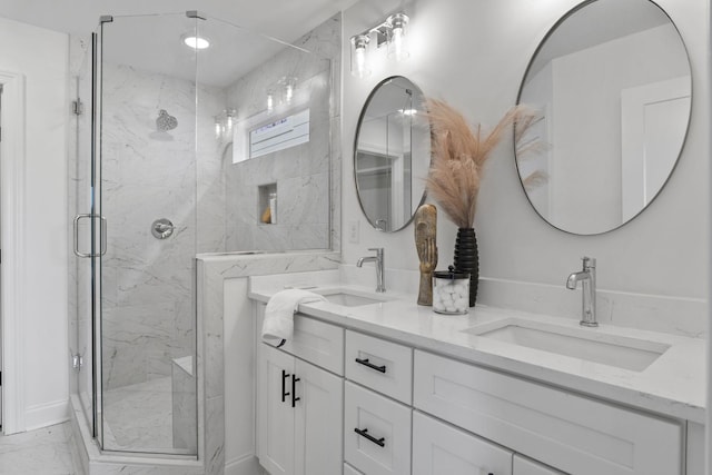 full bath featuring marble look tiles, a marble finish shower, and double vanity
