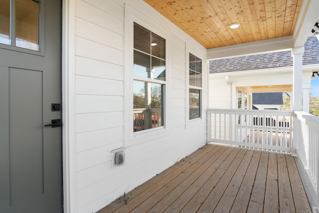 wooden terrace with a porch