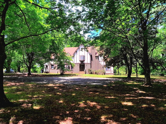 view of front of home featuring brick siding