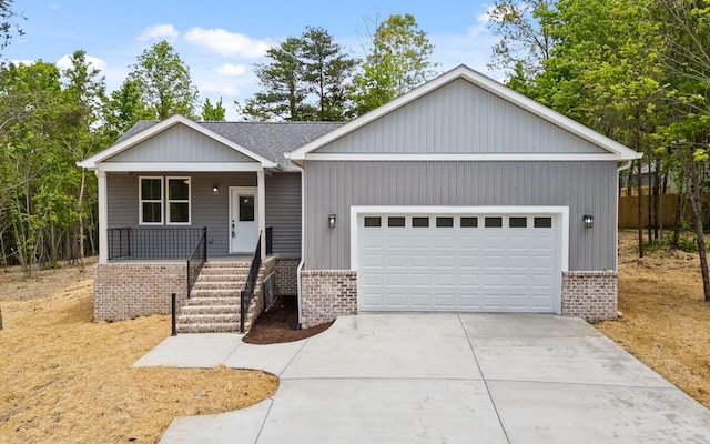 222 Grayson Way, Signal Mountain, TN 37377 - view of front of home with brick siding, a porch, an attached garage, and concrete driveway