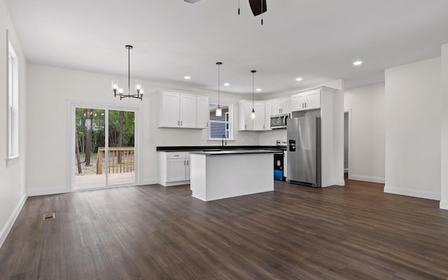 222 Grayson Way, Signal Mountain, TN 37377 - kitchen featuring stainless steel appliances, baseboards, dark countertops, ceiling fan, and dark wood finished floors