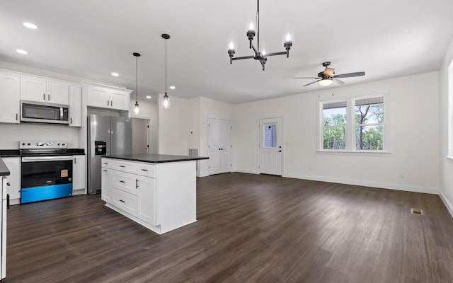 222 Grayson Way, Signal Mountain, TN 37377 - kitchen with appliances with stainless steel finishes, dark countertops, ceiling fan, dark wood-style floors, and white cabinetry