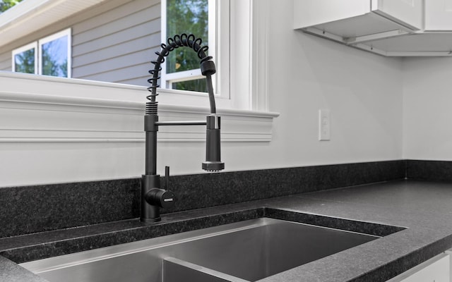222 Grayson Way, Signal Mountain, TN 37377 - kitchen view of a sink, dark countertops, and white cabinets