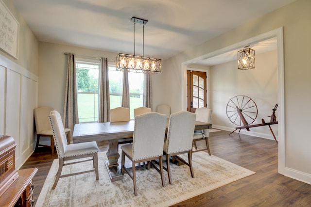 864 S Ridge Trl, Clarksville, TN 37043 - dining area featuring a chandelier, plenty of natural light, dark wood-style flooring, and baseboards
