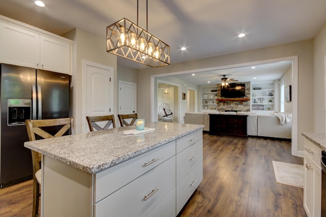 864 S Ridge Trl, Clarksville, TN 37043 - kitchen featuring stainless steel refrigerator with ice dispenser, dark wood finished floors, white cabinetry, open floor plan, and decorative light fixtures