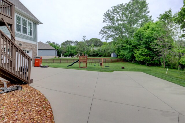 864 S Ridge Trl, Clarksville, TN 37043 - view of patio / terrace with a playground and view of wooded area