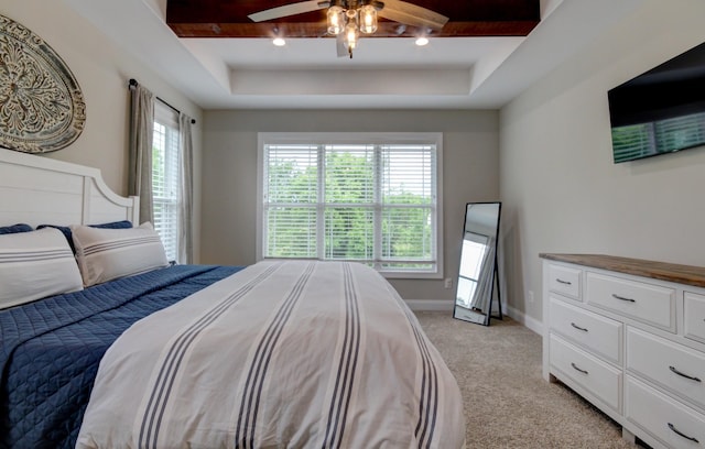 864 S Ridge Trl, Clarksville, TN 37043 - bedroom with a raised ceiling, light carpet, baseboards, and ceiling fan
