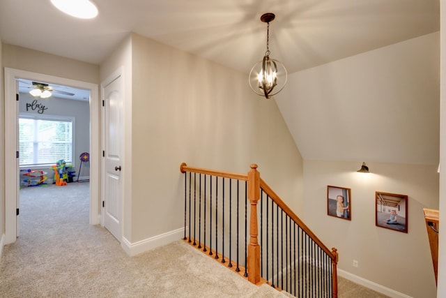 864 S Ridge Trl, Clarksville, TN 37043 - hallway featuring an upstairs landing, carpet, a chandelier, and baseboards