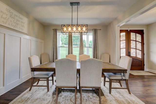 864 S Ridge Trl, Clarksville, TN 37043 - dining space featuring french doors, wood finished floors, a decorative wall, and wainscoting