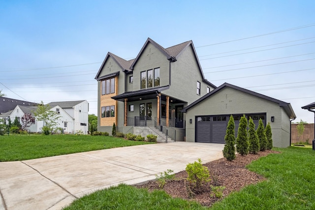 view of front of property featuring driveway, a front yard, covered porch, and a garage