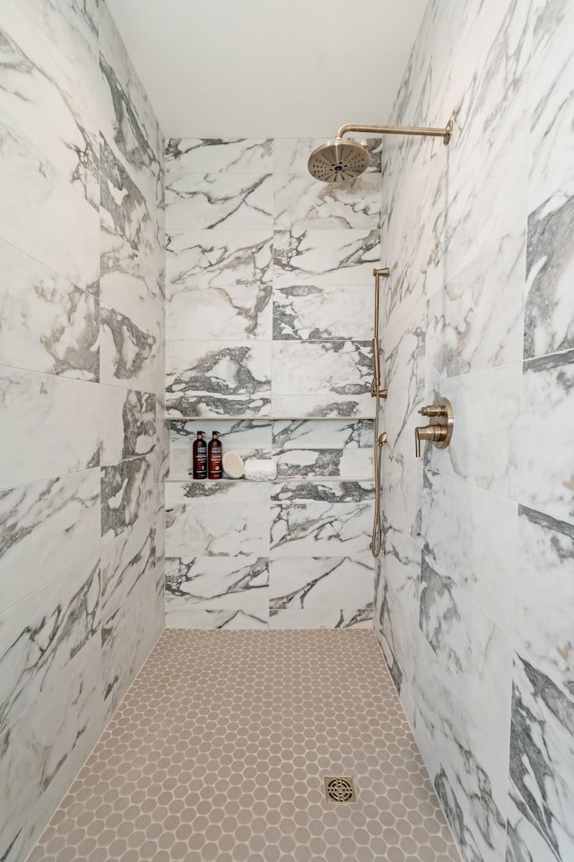 bathroom with tiled shower