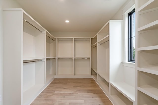 walk in closet featuring wood finished floors