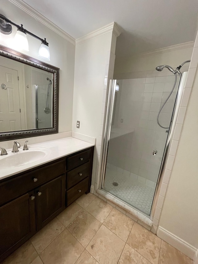 full bathroom with a shower stall, ornamental molding, vanity, and tile patterned floors