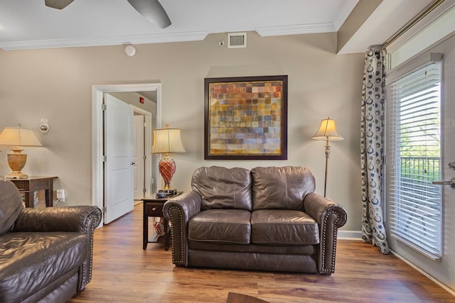 1410 Hurley Dr Unit 103, Sevierville, TN 37862 - living area with ornamental molding, wood finished floors, baseboards, and ceiling fan