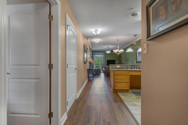 1410 Hurley Dr Unit 103, Sevierville, TN 37862 - hallway with dark wood-type flooring, crown molding, and baseboards