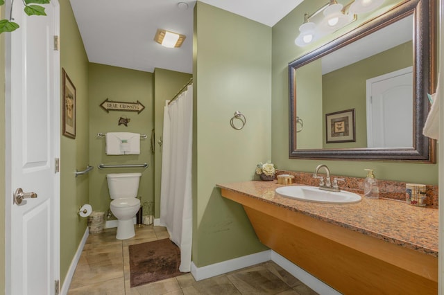 1410 Hurley Dr Unit 103, Sevierville, TN 37862 - full bathroom featuring toilet, vanity, tile patterned flooring, and baseboards