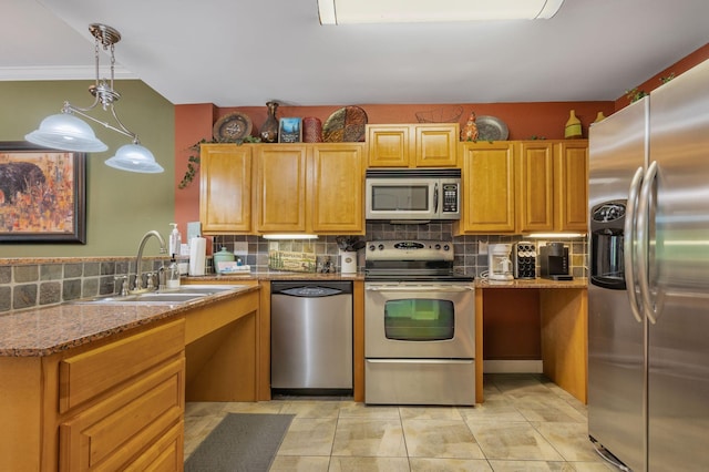 1410 Hurley Dr Unit 103, Sevierville, TN 37862 - kitchen featuring appliances with stainless steel finishes, a sink, backsplash, stone countertops, and decorative light fixtures