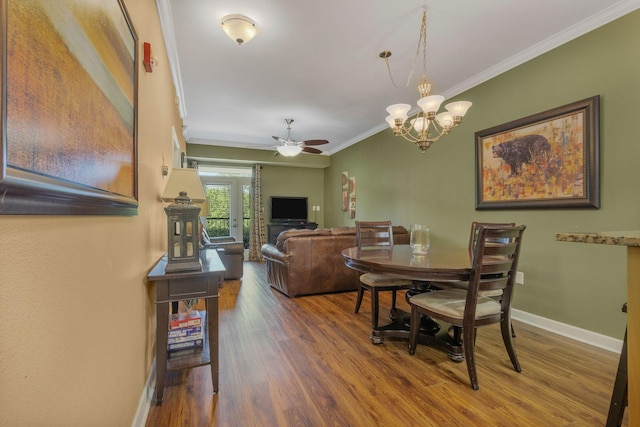 1410 Hurley Dr Unit 103, Sevierville, TN 37862 - dining space with crown molding, wood finished floors, ceiling fan, baseboards, and a chandelier