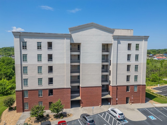 1410 Hurley Dr Unit 103, Sevierville, TN 37862 - view of apartment building / complex featuring uncovered parking