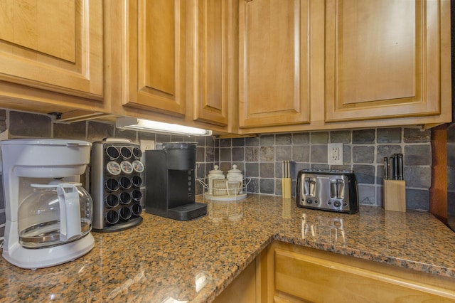 1410 Hurley Dr Unit 103, Sevierville, TN 37862 - kitchen featuring backsplash and dark stone counters