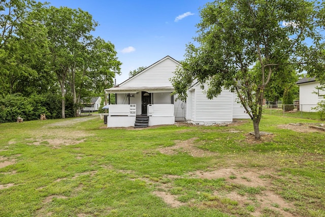 rear view of house with covered porch