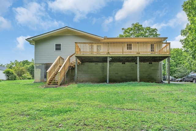back of house with a deck, stairway, and a yard
