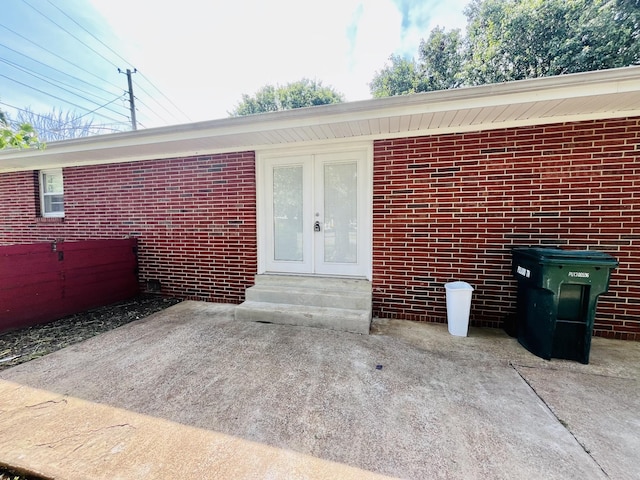 999 Mill St, Pulaski, TN 38478 - property entrance featuring brick siding, a patio, and french doors