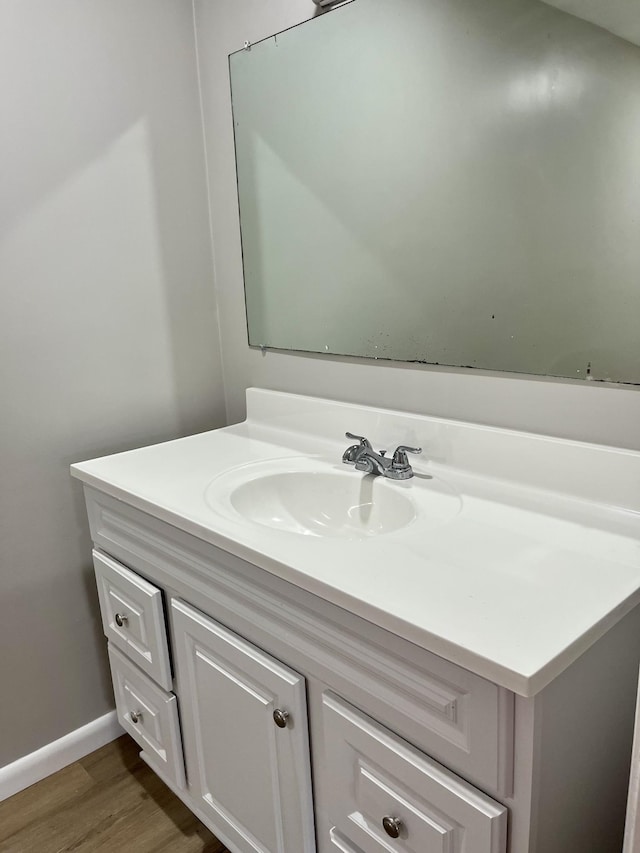 999 Mill St, Pulaski, TN 38478 - bathroom with wood finished floors, vanity, and baseboards