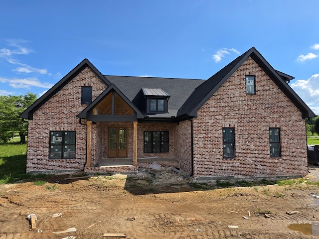 view of front facade featuring brick siding
