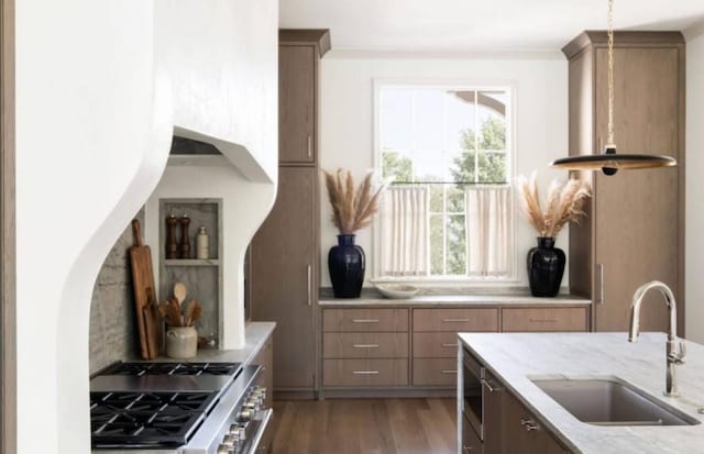 12 Middleton Park Ln, Nashville, TN 37215 - kitchen featuring a sink, high end stainless steel range, light stone countertops, light wood-type flooring, and tasteful backsplash