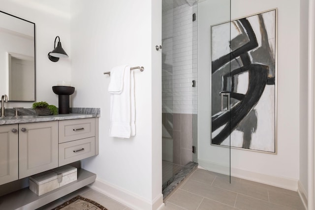 12 Middleton Park Ln, Nashville, TN 37215 - bathroom featuring vanity, tiled shower, baseboards, and tile patterned flooring