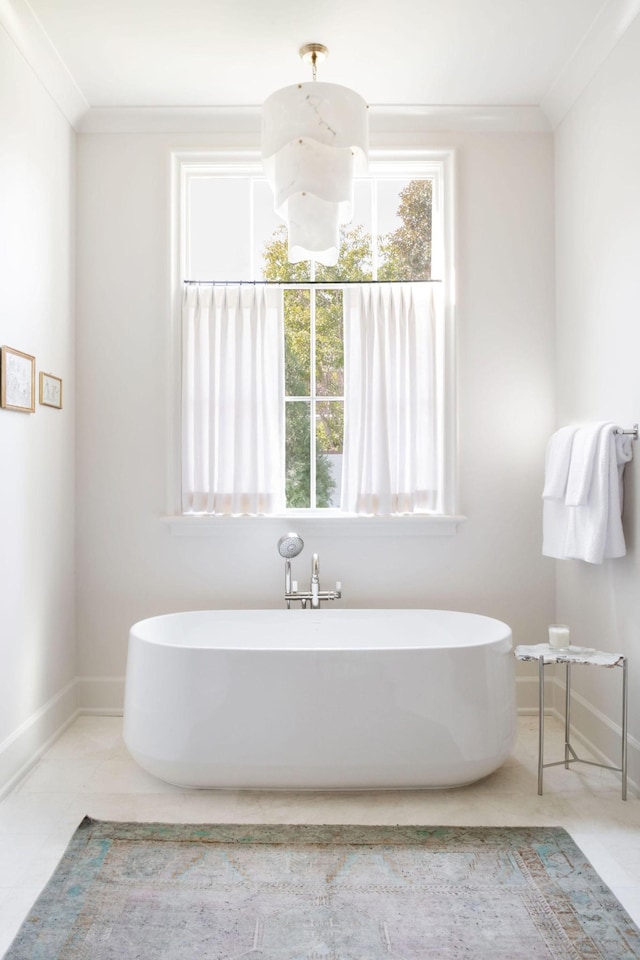 12 Middleton Park Ln, Nashville, TN 37215 - bathroom featuring a freestanding bath, baseboards, and ornamental molding