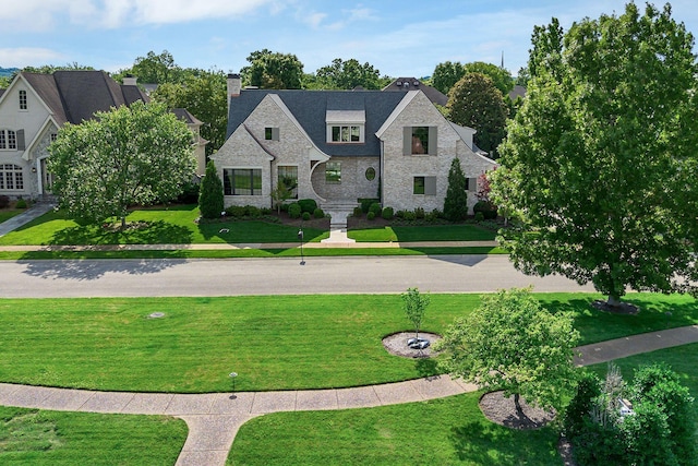 12 Middleton Park Ln, Nashville, TN 37215 - view of front facade with stone siding, a chimney, and a front yard