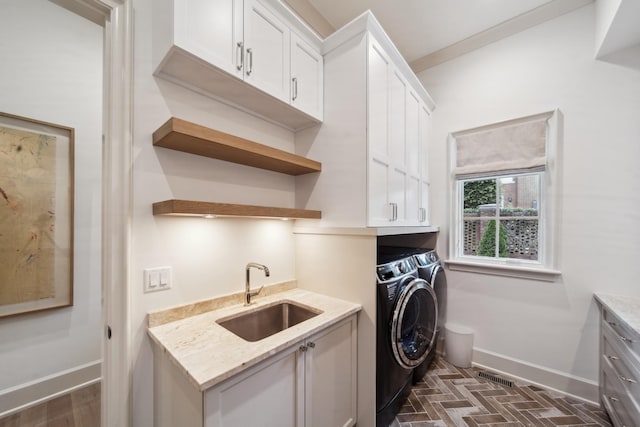 12 Middleton Park Ln, Nashville, TN 37215 - washroom with cabinet space, separate washer and dryer, baseboards, and brick patterned flooring