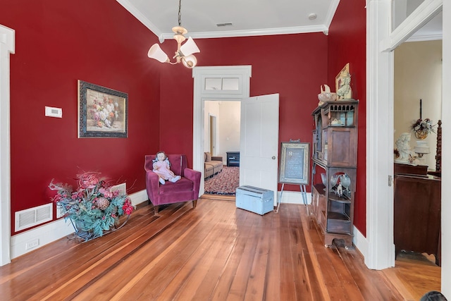 2033 Carters Creek Pike, Franklin, TN 37064 - sitting room with ornamental molding, hardwood / wood-style flooring, baseboards, and a chandelier