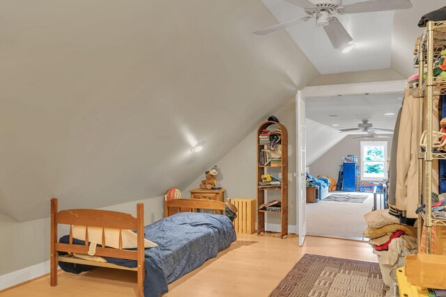 2033 Carters Creek Pike, Franklin, TN 37064 - bedroom featuring lofted ceiling, radiator heating unit, wood finished floors, access to outside, and ceiling fan