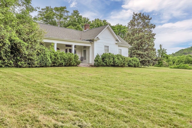 2033 Carters Creek Pike, Franklin, TN 37064 - view of front facade with a chimney and a front lawn