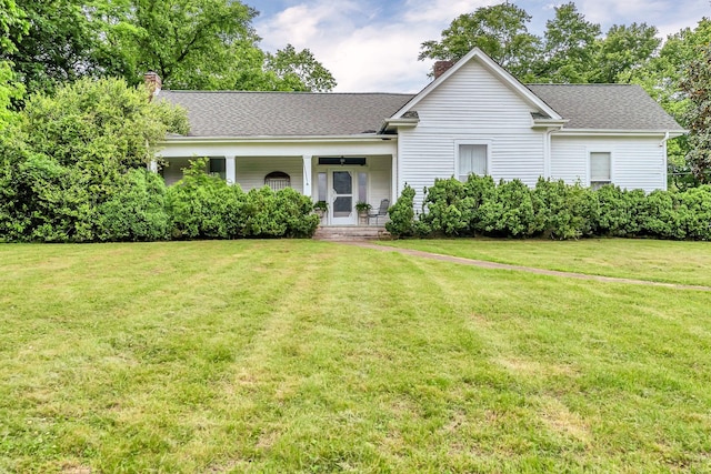 2033 Carters Creek Pike, Franklin, TN 37064 - view of front of home featuring a chimney, a front lawn, and a porch