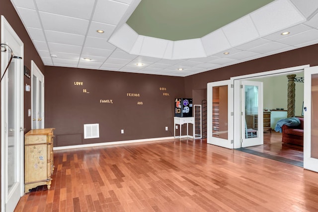 2033 Carters Creek Pike, Franklin, TN 37064 - empty room with a paneled ceiling, french doors, wood finished floors, baseboards, and recessed lighting